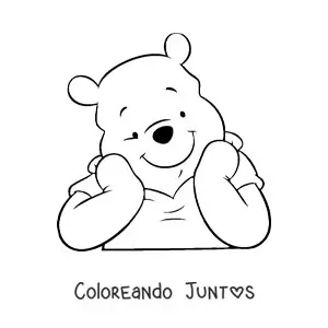 Imagen para colorear de la cara de Winnie Pooh apoyada sobre sus manos sonriente